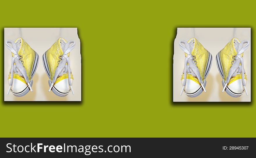 Hanged two pair of canvas shoes with isolated greenish background. Hanged two pair of canvas shoes with isolated greenish background