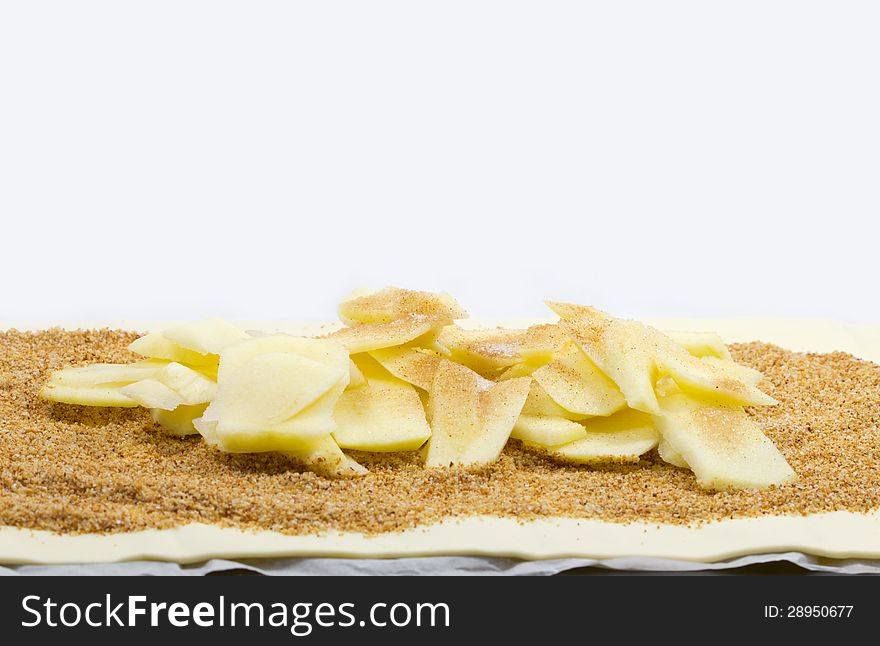 Raw dough pieces with fillingfor Apple strudel. Raw dough pieces with fillingfor Apple strudel.