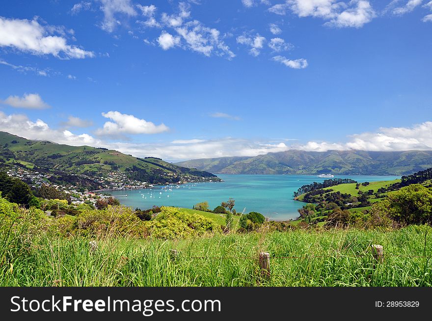 Beautifull Akaroa Harbour in the Banks Peninsula, South Island, New Zealand. Akaroa is a resort village and cruise ship tender port in 84km from Christchirch. Beautifull Akaroa Harbour in the Banks Peninsula, South Island, New Zealand. Akaroa is a resort village and cruise ship tender port in 84km from Christchirch.