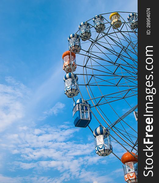 Ferris wheel in blue sky