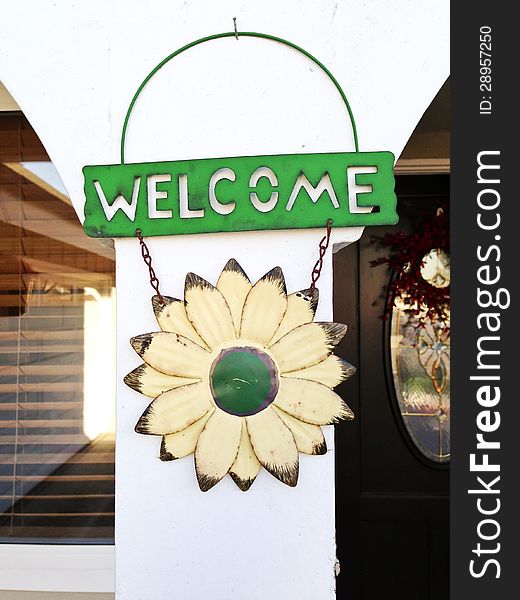 Welcome home sign on the front yard of a home