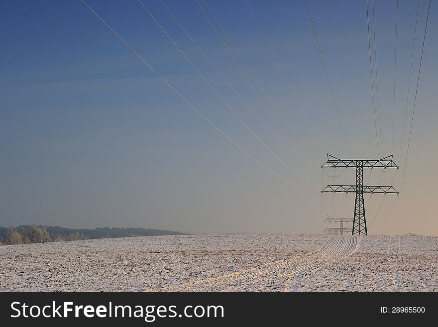 Electricity pylon in a field