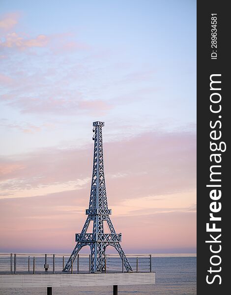 View of the prototype of the Eiffel Tower on the pier near the sea.