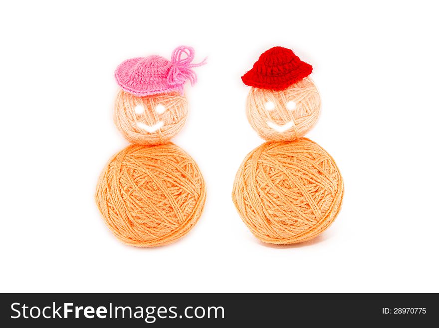 Simple doll made from balls of yarn, on white background. Simple doll made from balls of yarn, on white background.