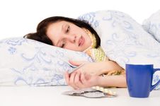 The Diseased Girl Lying In Bed, Drinking Tea Stock Images The Diseased Girl Lying In Bed, Drinking Tea Stock Images