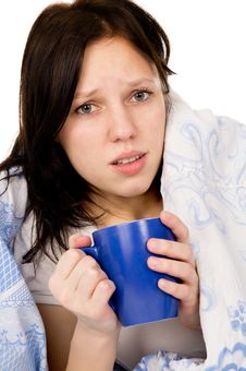 The Diseased Beautiful Girl Lying On The Bed, And Drink Medicine Royalty Free Stock Image