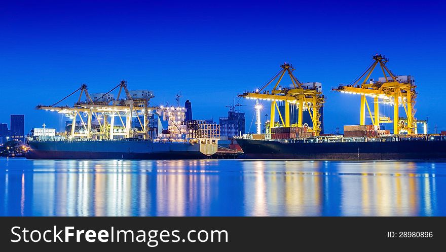 Industrial Container Cargo freight ship with working crane.