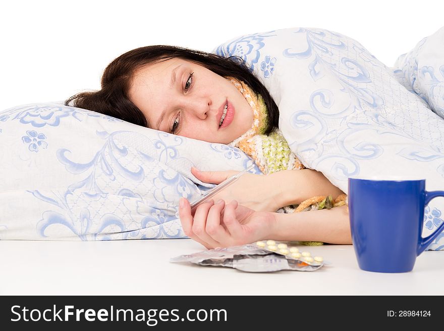 The diseased girl lying in bed on white background. The diseased girl lying in bed on white background