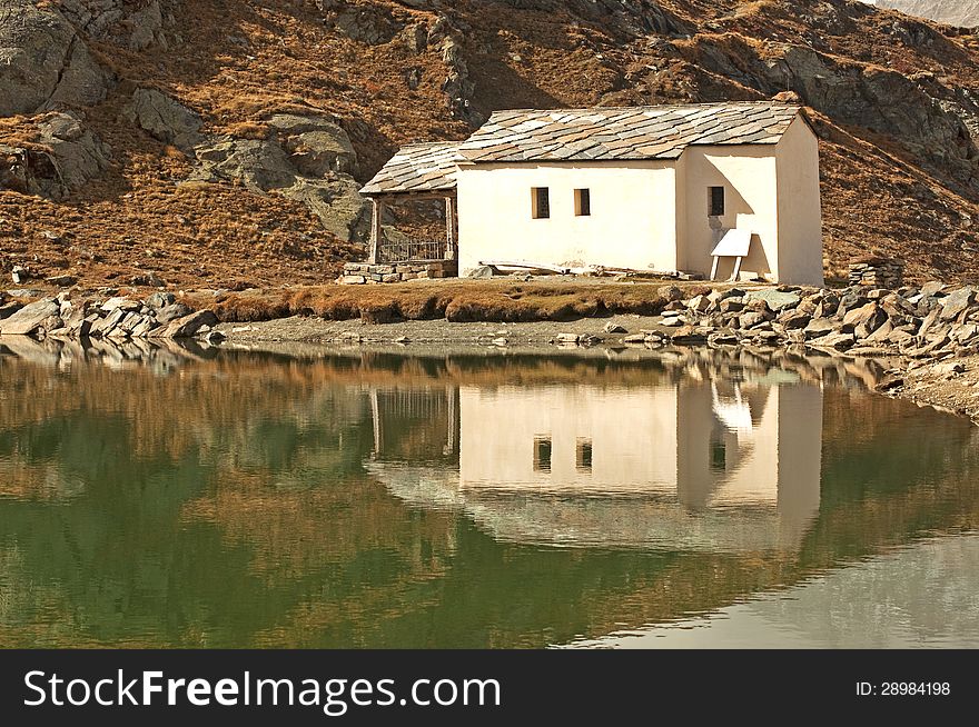 House with its reflection on a lake