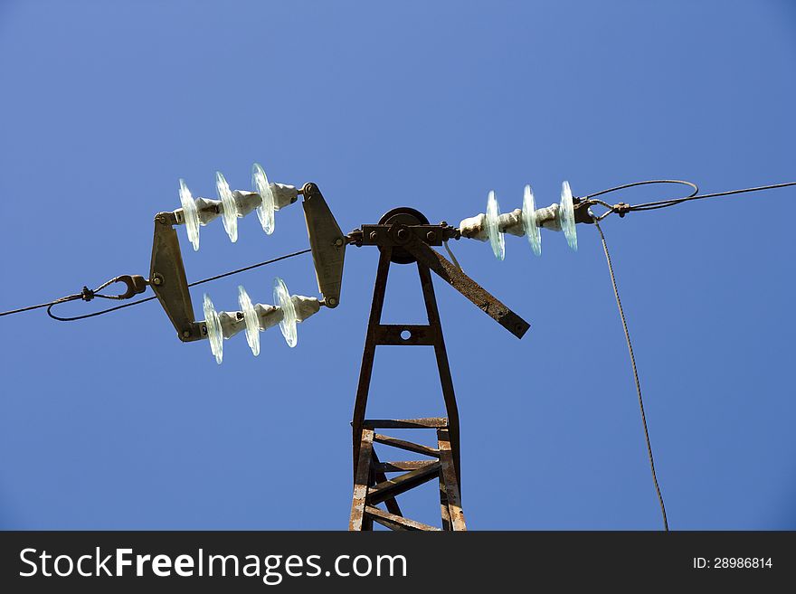 High-voltage insulator in the blue sky