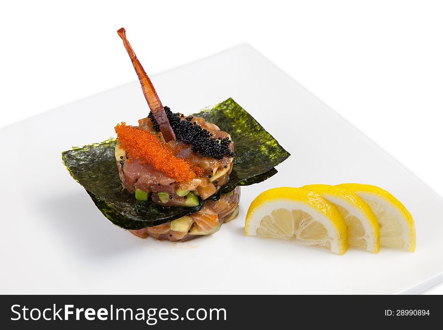 Originally decorated seafood dish, salmon, tuna and caviar. Originally decorated seafood dish, salmon, tuna and caviar