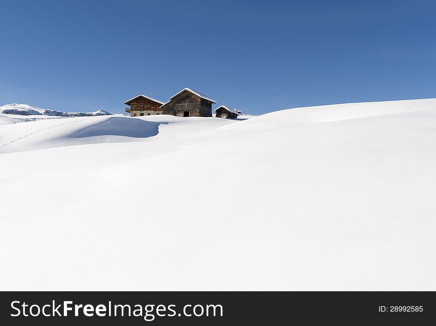 Alpine huts on untouched snow. Alpine huts on untouched snow