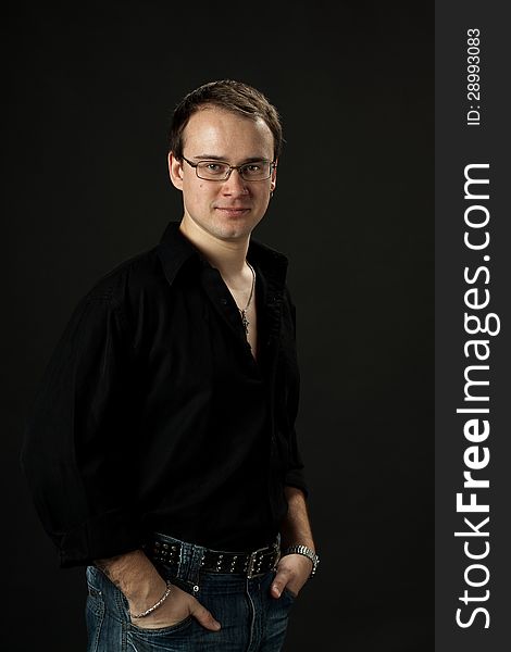 Portrait of young man posing standing in srtudio