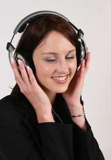 Businesswoman Listening To Her Favorite Music Stock Image