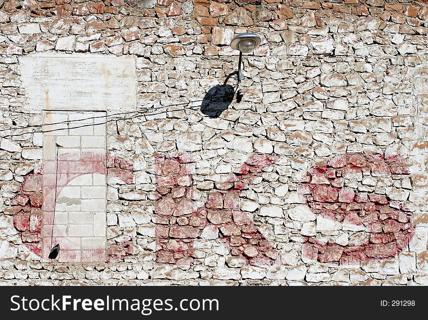 Side wall of an old and crumbling industrial building. Side wall of an old and crumbling industrial building