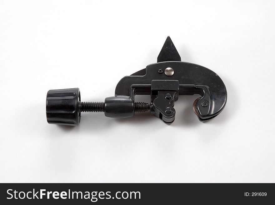 A brand new manual pipe cutter photographed on a white background