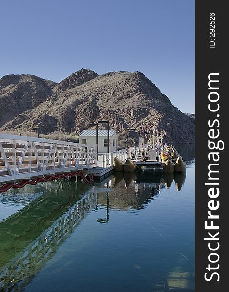 Dock for recreational pontoons on the Colorado River at Willow Beach in the desert. Dock for recreational pontoons on the Colorado River at Willow Beach in the desert