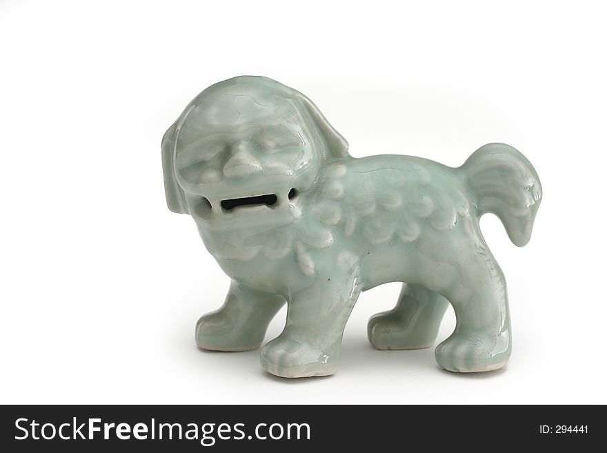 Glazed Chinese lion sculpture a symbol of power, prosperity and warding away of evil. Glazed Chinese lion sculpture a symbol of power, prosperity and warding away of evil.