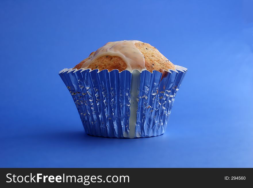 A muffin on blue background. A muffin on blue background