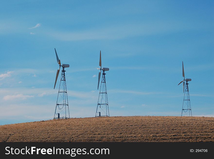 Modern windmills in northern Califronia generating electricity. Modern windmills in northern Califronia generating electricity.