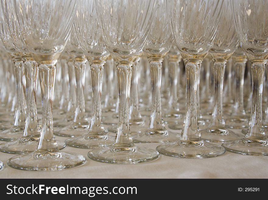 Numerous Champagne glasses arranged in rows. Numerous Champagne glasses arranged in rows