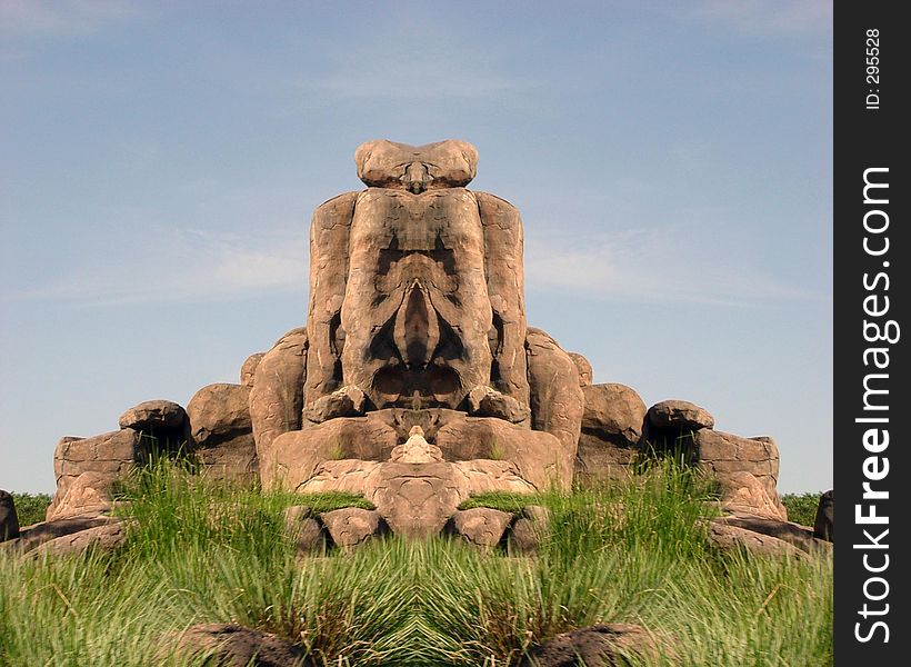 Symmetric rock formation made from a pillar of rocks into what could be seen as a pig's face. Symmetric rock formation made from a pillar of rocks into what could be seen as a pig's face