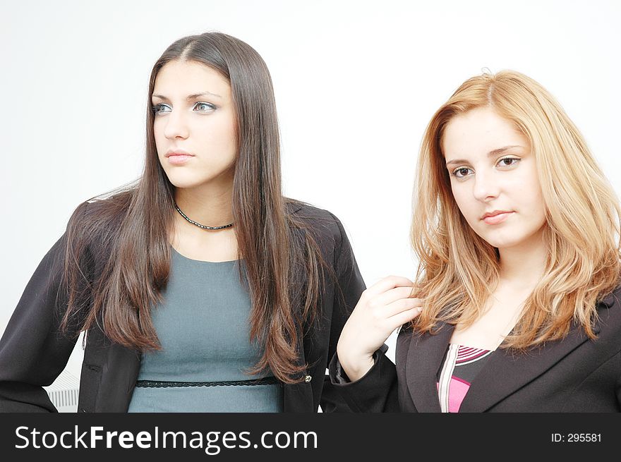 Two beautiful young women in bussiness outfits. Two beautiful young women in bussiness outfits