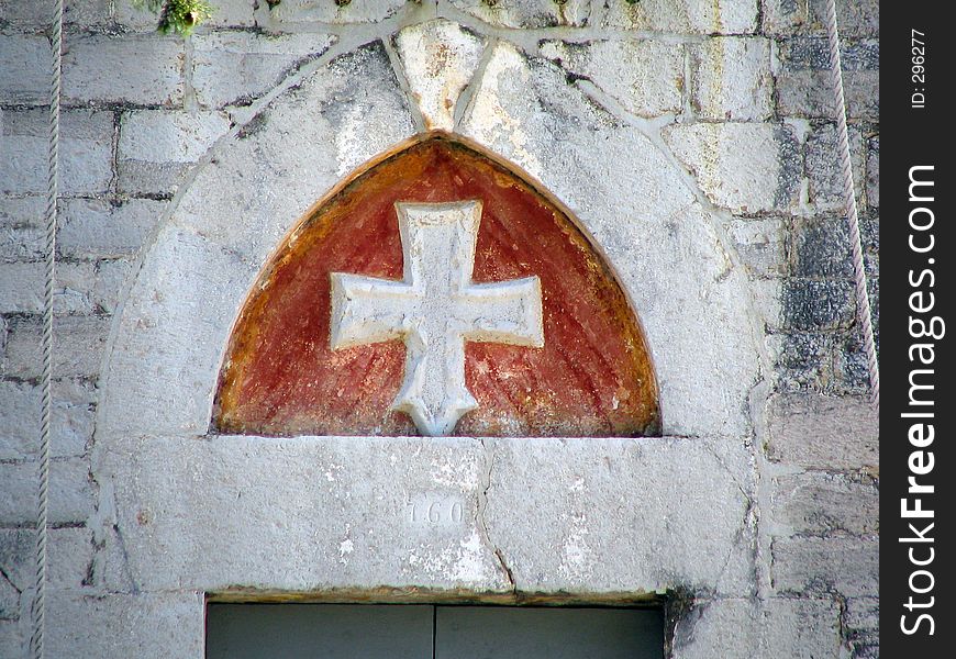 The cross above the church doorway