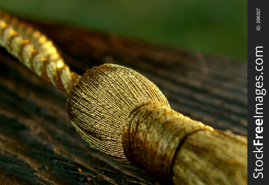 Golden knot on wood