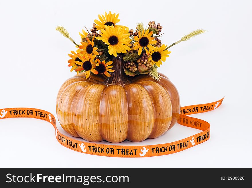 Halloween Pumpkin with flowers and Treat-or-Treat Banner. Halloween Pumpkin with flowers and Treat-or-Treat Banner