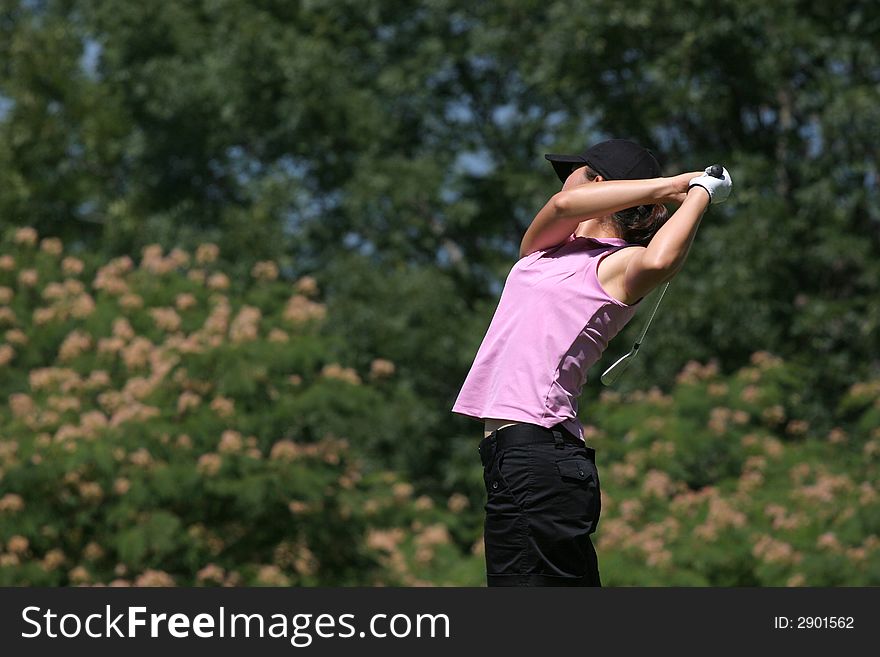 Lady golf swing with flowers