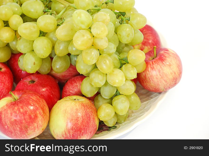 Grapes and apples close-up on white background