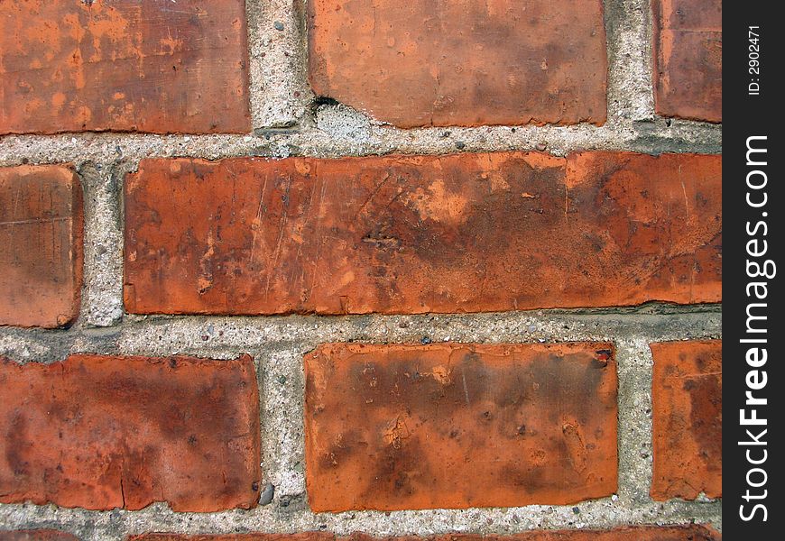 Details of a wall made of brown solid bricks. Details of a wall made of brown solid bricks