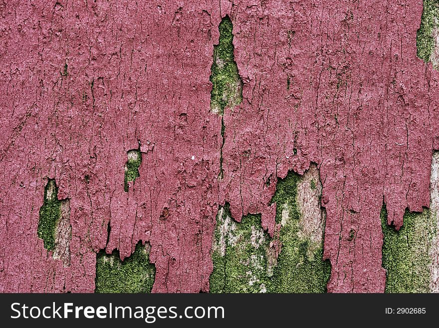 Peeling of paint on an old wooden fence. Peeling of paint on an old wooden fence