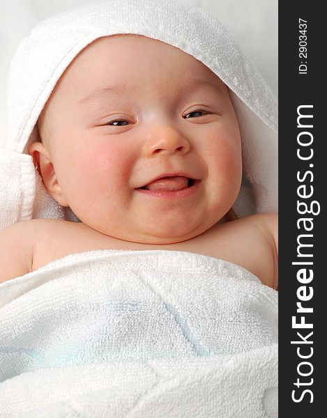 Sweet child under towel on white background. Sweet child under towel on white background