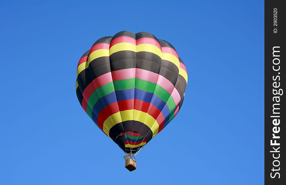 Hot Air Balloon Isolated in the Blue Sky