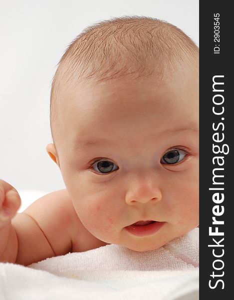 Sweet child under towel on white background. Sweet child under towel on white background