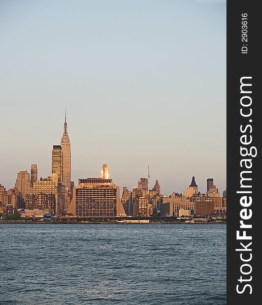 A vertical view of the New York City skyline at dusk. A vertical view of the New York City skyline at dusk.