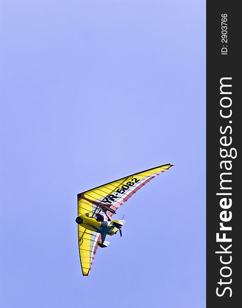 A pilot enjoys the freedom of a powered paraglider. Initials and number changed in PS.