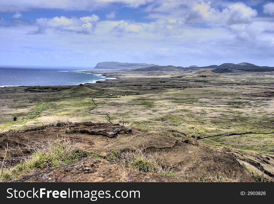 Plateau on the top of a hill with volcanoes in the background. Plateau on the top of a hill with volcanoes in the background