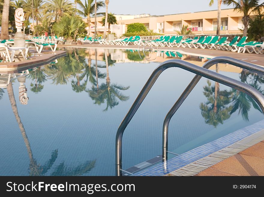 A beautiful pool and sun loungers. A beautiful pool and sun loungers