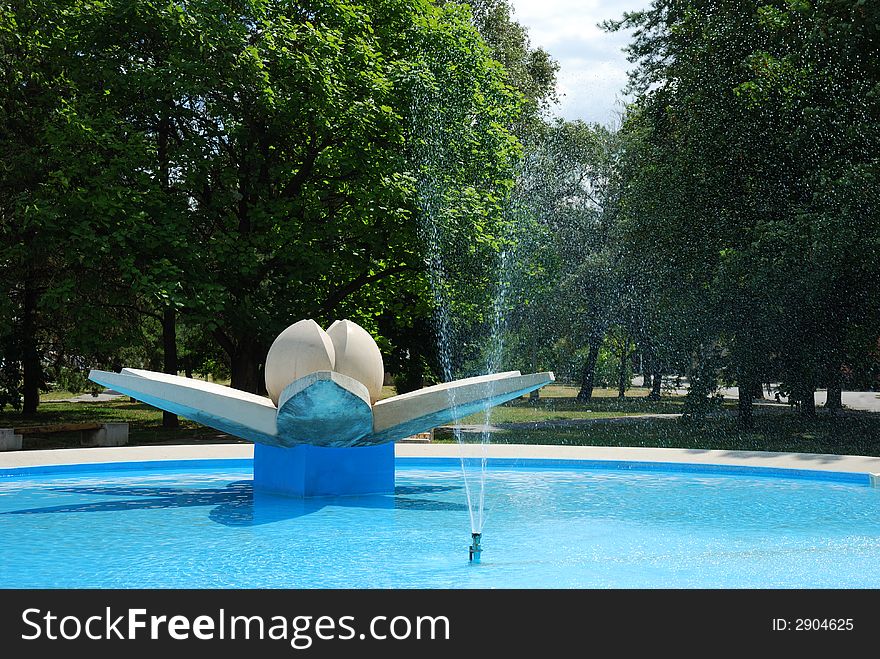 Water fountain with tree in the background, slovakia