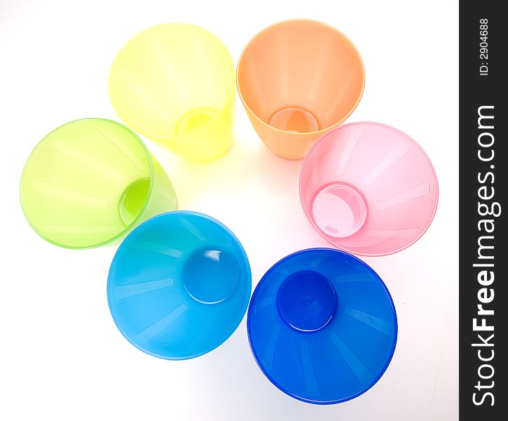 Colourfull plastic cups, bright and cheery.