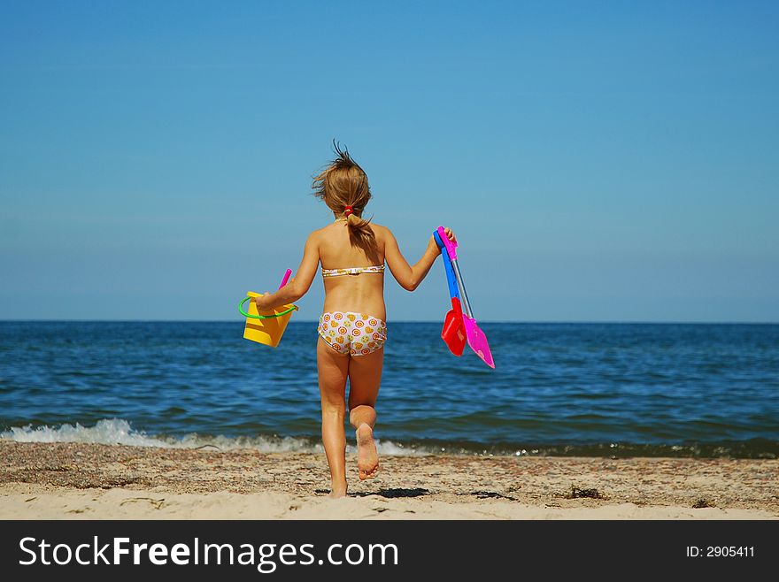 Girl playing on a beach