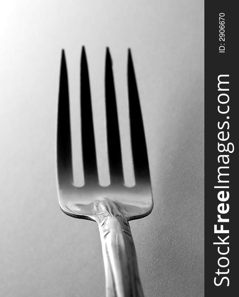 Metallic Fork over grayish background