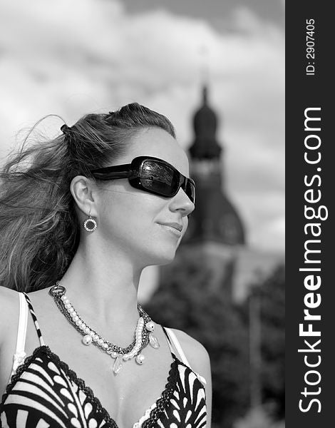 Beautiful young girl with sunglasses in the city. Beautiful young girl with sunglasses in the city