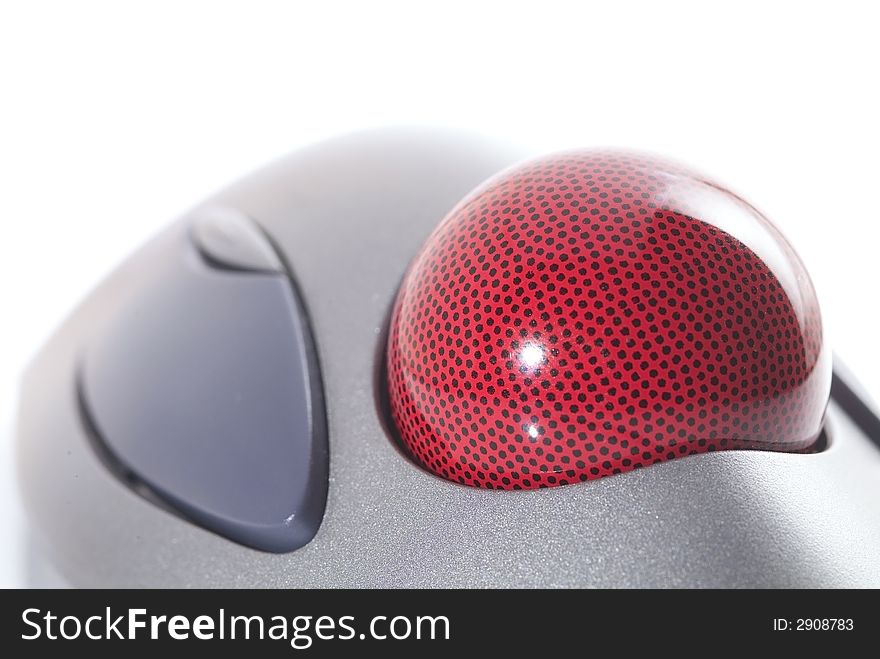 Detail of trackball, a computer pointing device, isolated on white background. Shallow depth of field with the ball in focus.
