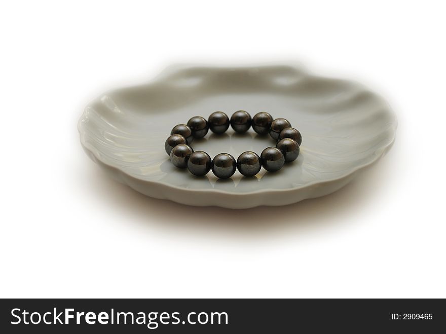 Black pearls in the white shell plate