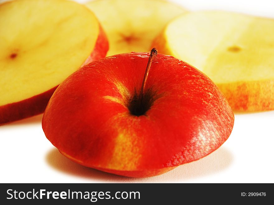 Red apple slices isolated on white background