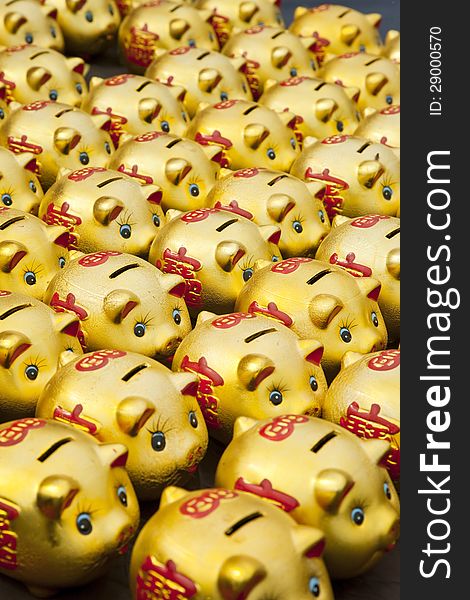 Lot of golden Chinese piggy banks. Lot of golden Chinese piggy banks